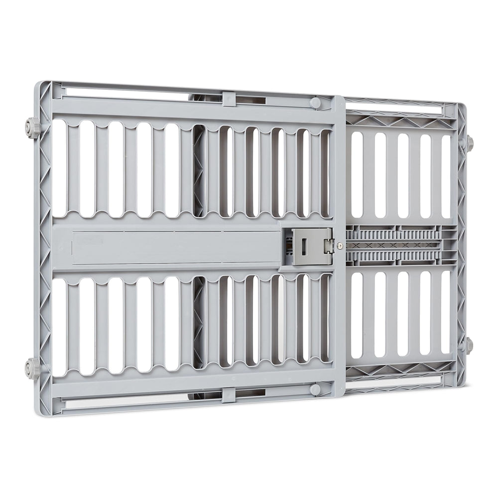 Amazon Basics adjustable wide dog gate extended to fit large doorways safely