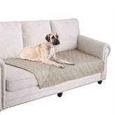 Ameritex waterproof blanket reverses on sofa, protecting furniture from pet use.