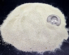 Aqua Natural oolitic aragonite sand laid in a tank bed supports bacteria and grain stability.