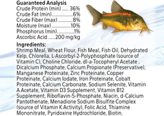 Aqueon Shrimp Pellets in aquarium showing bottom-feeder snacking.