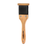 Artero Double Flexible Brush gray-side pins spreads coat and opens fur for grooming.