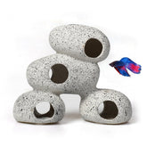 AWXZOM resin rock cave with moss creates natural hiding spots for small fish.