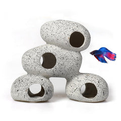 AWXZOM resin rock cave with moss creates natural hiding spots for small fish.