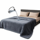 Bedding Aid waterproof throw blanket in moon grey protects sofas from spills