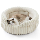 Bedsure ComfyFleece cat bed in cream round provides cozy security for indoor cats.