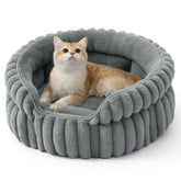 Bedsure ComfyFleece cat bed round shape offers cozy shelter for indoor cats.