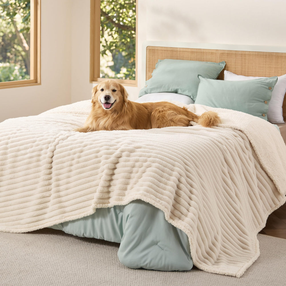 Bedsure ComfyFleece blanket with waterproof lining protecting furniture from spills.