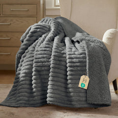 Bedsure ComfyFleece blanket on sofa guarding furniture from spills with waterproof interior
