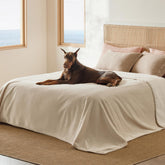 Bedsure waterproof blanket on bed in cream protects surfaces from moisture