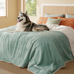 Bedsure waterproof blanket on bed with Sherpa warmth and moisture protection