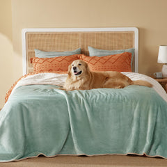 Bedsure waterproof blanket on bed showing cozy Sherpa warmth for pets.