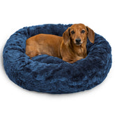 Best Friends by Sheri Donut Bed in navy creates a cozy haven for dogs up to 25 lbs.
