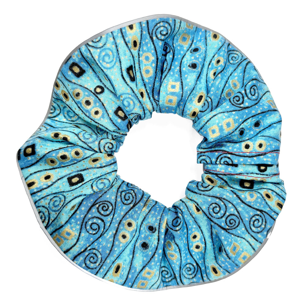 Birdsbesafe Bejeweled Stripes collar cover on a calm cat increases bird visibility.