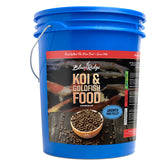 Blue Ridge Koi Food 14lb floating pellets gliding on water for steady growth and pond vitality.