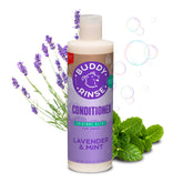 Buddy Rinse conditioner bottle pour shows easy application for a smoother dog coat.