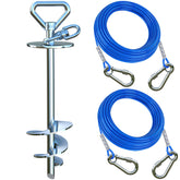 Catapamey dog tie out stake securely anchored in ground for yard safety.