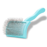 Chris Christensen Big G Slicker in teal with ergonomic handle for comfortable grooming.