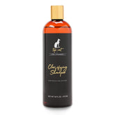 Chris Christensen Top Cat Clarifying Shampoo bottle being poured for a gentle coat refresh