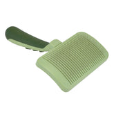 Coastal Safari self-cleaning slicker brush close-up with retractable pins for gentle detangling.
