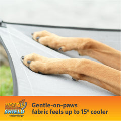 Coolaroo HeatShield fabric blocks sun heat, keeping your dog cooler during sunny adventures.