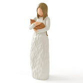 Cuayaes orange cat figurine in arms, a gentle remembrance gift.