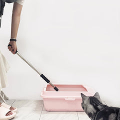 Depets cat litter scoop showing detachable handle for adjustable reach.