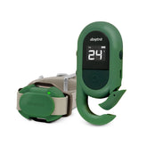 Dogtra CUE Green remote trainer held in hand for easy control.