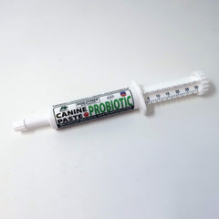 Dogzymes paste on dog food for easy administration.