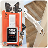 Door Buddy cat door prop on door keeps dogs out while cats stay freely accessible.