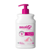 Douxo S3 Calm Shampoo bottle pour for gentle cleansing.