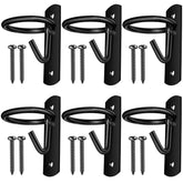 Dunzy bucket hooks in use for hanging a water bucket in a horse stall.