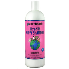 Earthbath Wild Cherry Puppy Shampoo bottle pour showing a gentle, odor-neutralizing wash for puppies