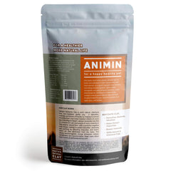 Earth's Living Animin clay scoop beside jar for easy pet dosing.
