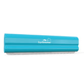 EquiGroomer deshedding brush in turquoise removes loose fur from horses and large pets.