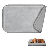 Explore Land waterproof dog bed cover on plush surface protects against spills.