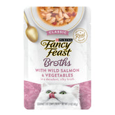 Fancy Feast lickable broth with wild salmon over kibble for added moisture.