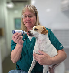 Fetch A Vet EZ Dose bottle cap enabling easy dosing during a pet emergency.