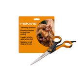 Fiskars pet grooming scissors with orange and black handle for precise trimming.