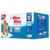 Four Paws Wee-Wee XL pad with runoff guard protects floors during use.