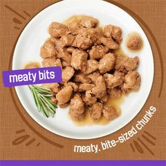 Friskies Meaty Bits Gourmet Grill with gravy highlighting moisture and flavor.