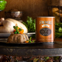 Closeup of Fromm chicken pate cans showing premium packaging