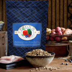 Fromm Whitefish & Potato ingredients in bowl show wholesome fruits and vegetables.