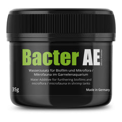 GlasGarten Bacter AE powder additive dissolving in a shrimp tank to support water health