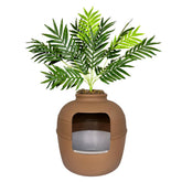 Good Pet Stuff Hidden Litter Box Planter with palm conceals litter neatly.