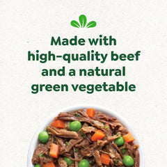 Happy dog savoring mealtime with Greenies Smart Topper topping.