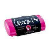 Groomi deshedding brush front view with ergonomic grip for easy grooming.