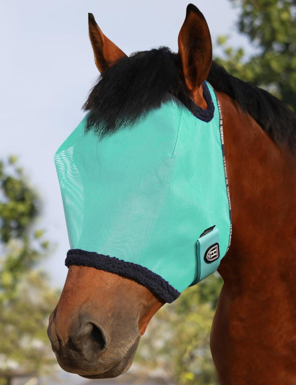 Harrison Howard All Round Mesh Fly Mask front view offers UV protection for sunny rides.