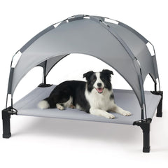 Heeyoo elevated dog bed with canopy provides shade for outdoor lounging.