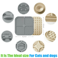 Honomastry lick pad with suction cups attached to a wall for secure grooming.