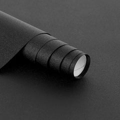 Hygger CO2 backdrop in black rolled for clean aquarium aesthetics and easy installation.